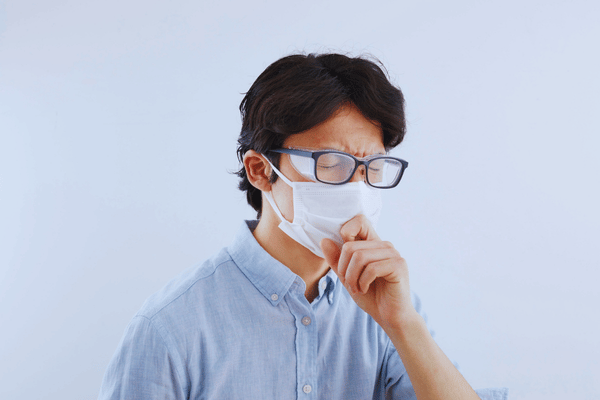 Masked individual with deep respiratory discomfort